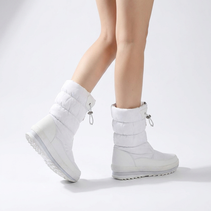 Velora boots worn in white studio